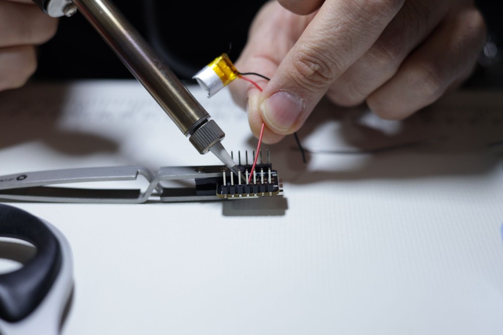 Soldering the radio module to the carrier board.